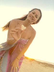 A woman holding a heart in her hand.